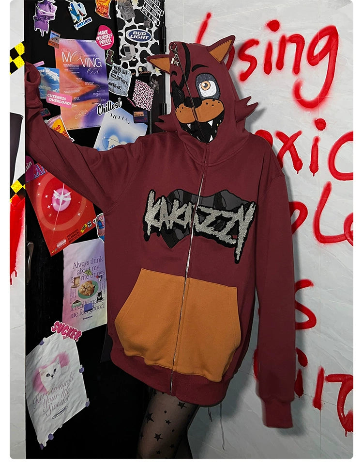 A person in a Seakoff Foxy-Inspired Hoodie, a red 400GSM oversized zip-up with animal ears reminiscent of Five Nights at Freddy&