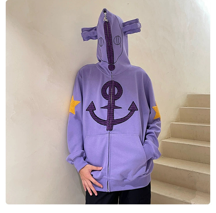 Clad in an oversized Seakoff Purple Symbol Hoodie, featuring an anchor emblem and star patches, the individual hides their face with the hood&