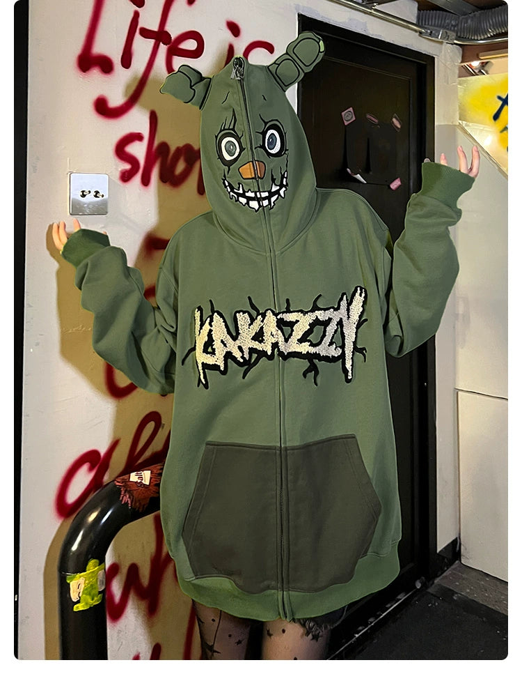 Someone wears a Seakoff Springtrap-Inspired Hoodie, an oversized green zip-up sweatshirt from Five Nights at Freddy&