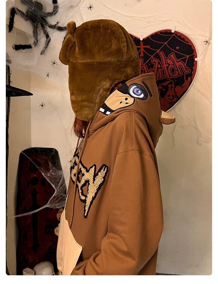 A person wears a Seakoff Freddy-Inspired Hoodie, a 400GSM oversized brown zip-up sweatshirt from Five Nights at Freddy&
