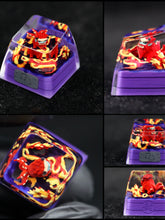 This Naruto Tailed Beasts Keycap, part of the Kurama, Shukaku, and Saiken collection, showcases a red dragon entwined with flames. A transparent cover highlights the intricate design on a black and purple base, showcasing detailed craftsmanship as a standout piece in the collection.