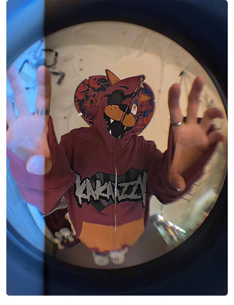 A person in a Seakoff Foxy-Inspired Hoodie, featuring a cartoon animal face on the hood, has their hands raised. Distorted by a fisheye lens effect, the scene echoes Five Nights at Freddy&