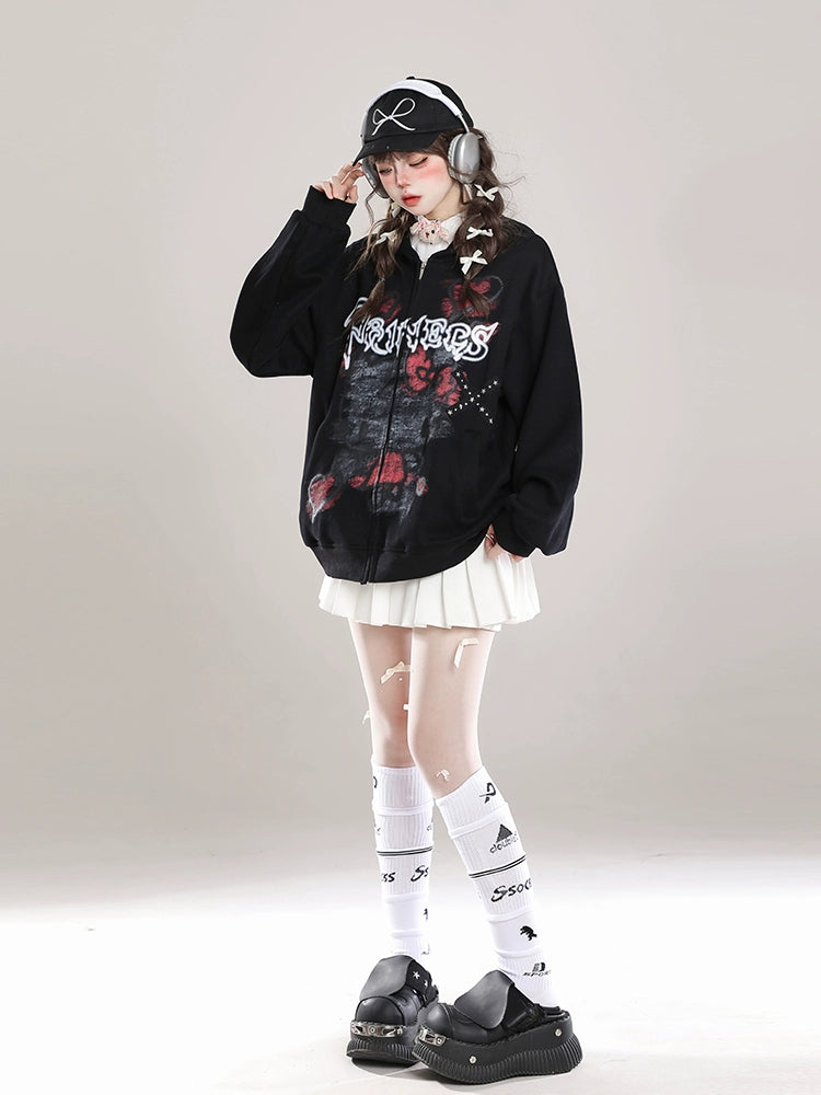 Sporting the Seakoff Gothic Hello Kitty Princess Hoodie, an oversized zip-up with edgy heart and cross graphics, a person pairs it with a pleated white skirt, knee-high socks, chunky platform shoes, headphones, and a bow-accented black cap amidst scattered feathers for kawaii flair.