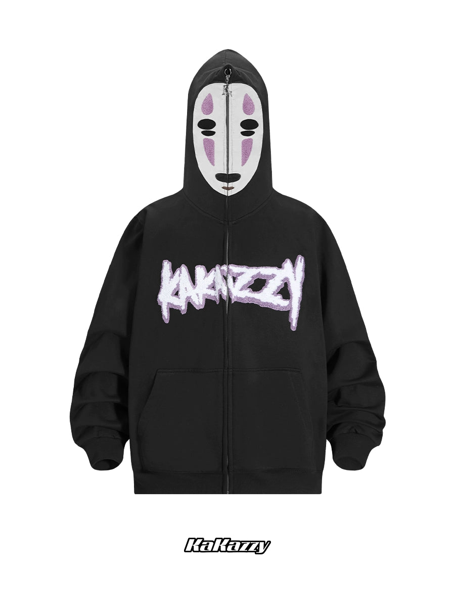 The No-Face Anime Hoodie by Spirited Away is a black 400GSM oversized zip-up sweatshirt featuring a stylized mask on the hood, "Kakazy" in white graffiti text across the chest, scrunched sleeves, and matching logo below—ideal for anime fans.