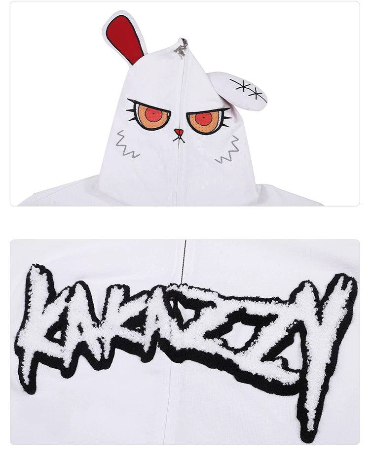 Close-up of the Seakoff Fierce Bunny Hoodie, featuring a cartoonish face with intense red eyes and vivid red rabbit ears. The back displays bold, stylized black "KAKAZZY" text on its oversized 400GSM cotton fit.