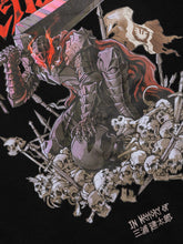 A detailed illustration of a Black Swordsman in spiked armor wielding a large sword, surrounded by skulls and bones. The knight has glowing red eyes and wears a red cape. "In memory of" text with Japanese characters is at the bottom right, reminiscent of the Berserk Guts Anime Hoodie design.