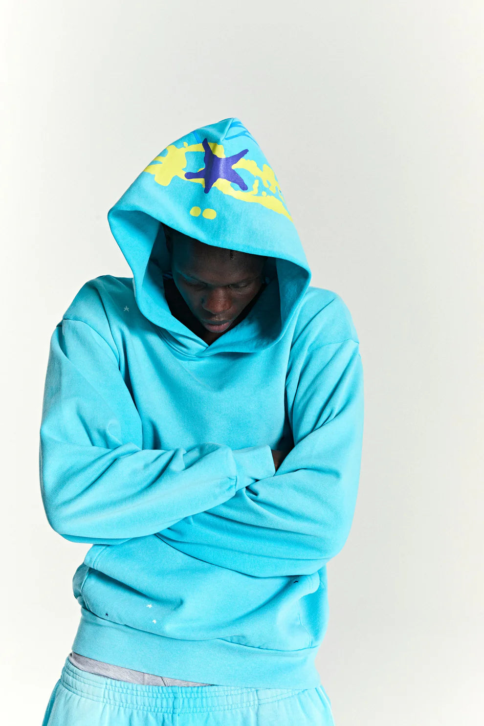 Turquoise Graphic Hoodie with Star Detail and Spider Web Back Print – Comfort Fit Pullover Hoodie