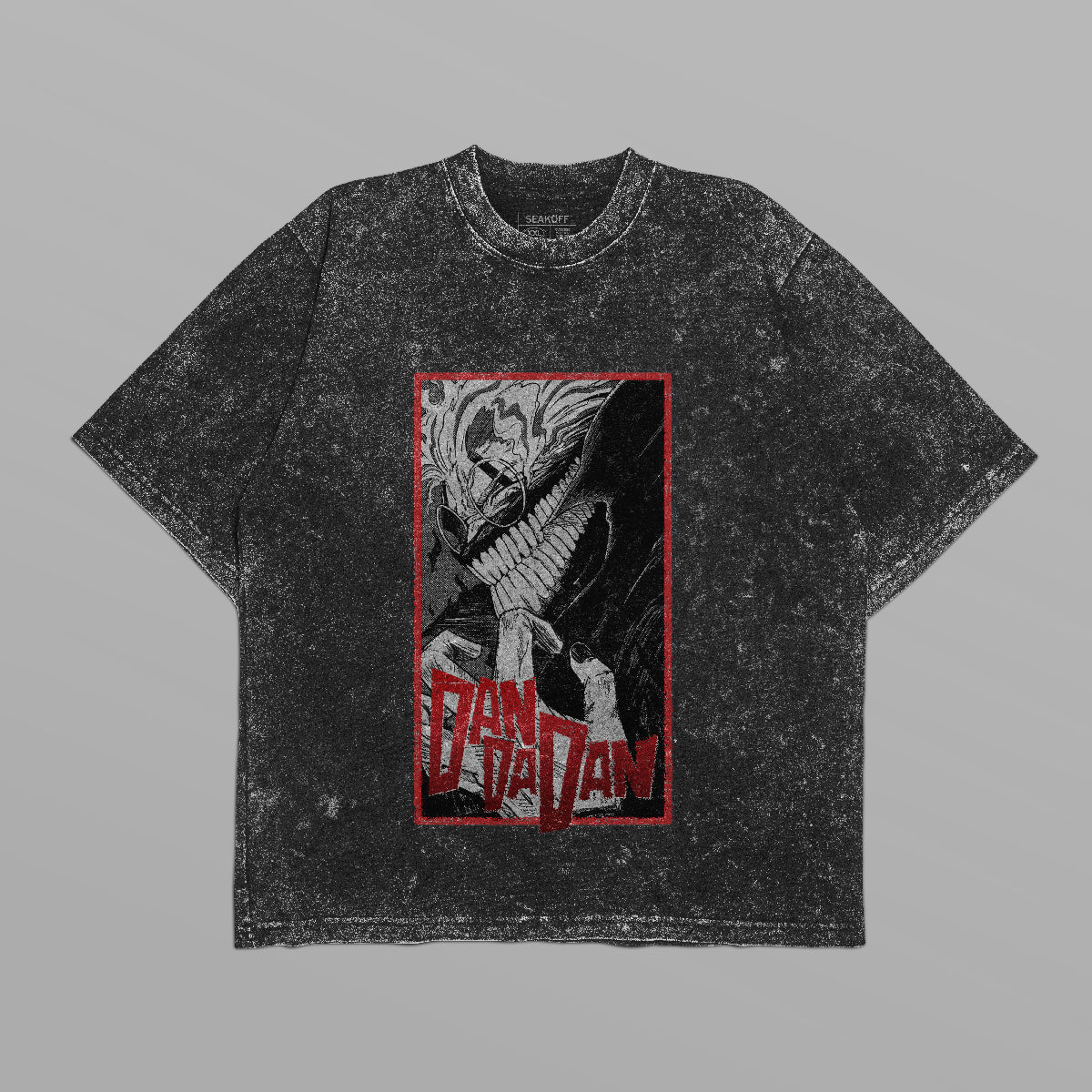 The Dandadan Monochrome Oversized T-Shirt features an Okarun graphic with sharp teeth and bold red "Danzan" text, offering a worn vintage vibe ideal for anime streetwear enthusiasts.