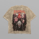 This oversized Dandadan T-shirt is anime-inspired streetwear featuring a colorful back graphic of three characters with bold red "Dandadan" text above, set against a cityscape, made in 250 GSM cotton.