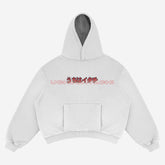 The Naruto Itachi Uchiha Hoodie is a 100% cotton, light gray street-style anime apparel featuring red and black stylized text with "Uchiha Itachi" on the front. It has a kangaroo pocket, ribbed cuffs, and hem, ideal for street-style enthusiasts. Laid flat against a light background.