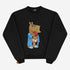 The Chill Guy Morning Chill Guy Sweatshirt is a relaxed, fleece-lined cotton pullover featuring a cartoon horse head character in a blue robe with slippers and patterned shorts, holding a red cup. Available in black, white, and blue.