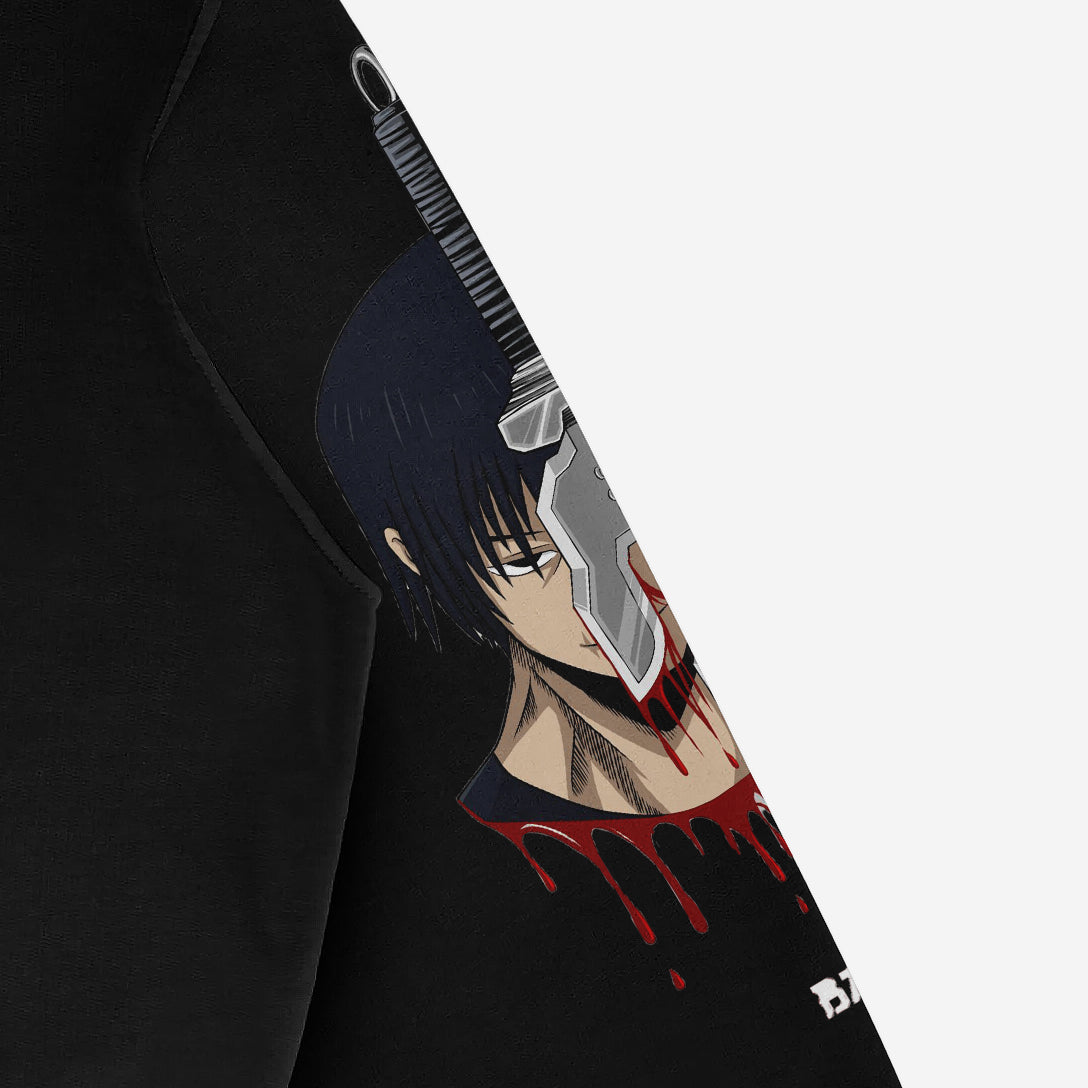Close-up of the Jujutsu Kaisen Toji Fushiguro Oversized Hoodie in black, showcasing high-definition graphics from the anime. The design features Toji with a knife in his head and blood details, using bold lines and dark colors, partially visible on the sleeve.