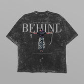 The Jujutsu Kaisen Toji Fushiguro "Behind" Vintage Oversized T-Shirt features a streetwear anime graphic with a sword-wielding figure, large "BEHIND" text, and small text surrounding it on distressed black, inspired by Jujutsu Kaisen&
