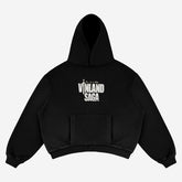 The Berserk Official Vinland Saga Hoodie in black, made from premium 360 GSM cotton, features a hood and front pocket and showcases "Vinland Saga" text in white on the back, embodying Thorfinn&