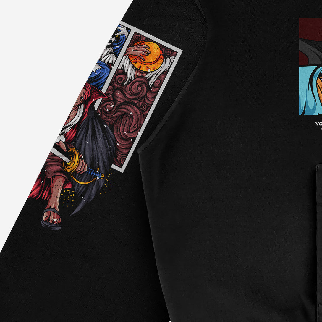 A close-up of a One Piece Hoodie sleeve by Seakoff reveals vibrant abstract designs in red, orange, blue, and white on black fabric. Crafted from premium 360 GSM cotton, this anime graphic pullover features Uta and Luffy designs with visible folds and stitching—perfect for your wardrobe.