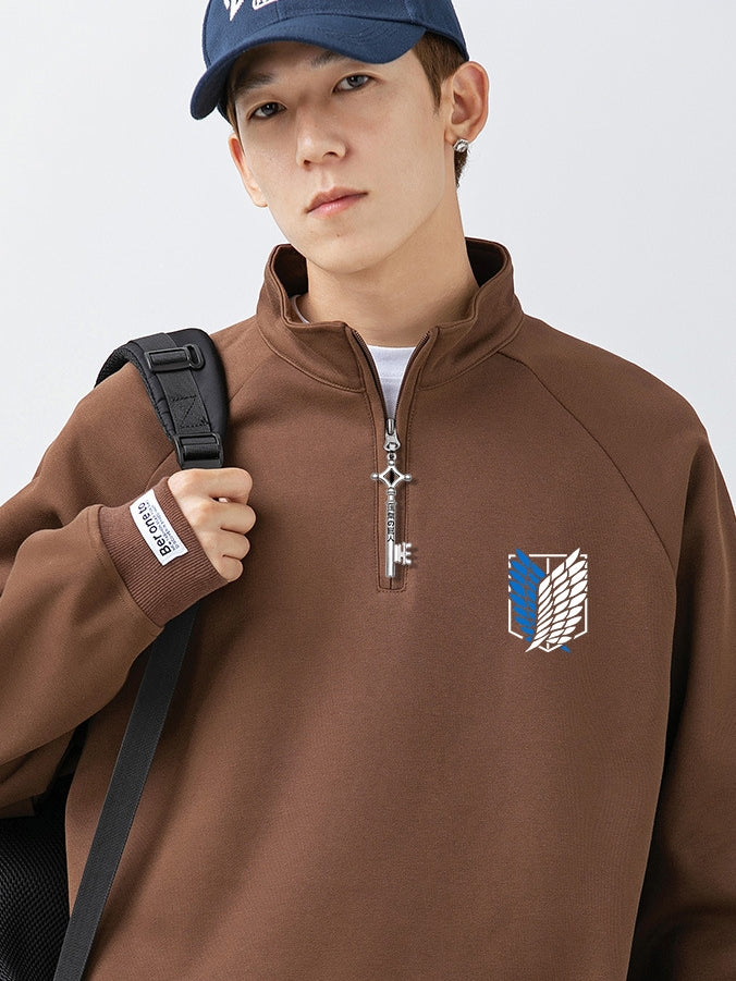 Wearing a Limited Edition Attack on Titan Half-Zip Sweatshirt with Eren’s key zipper and the Scout Regiment logo, they sport a dark blue cap and backpack, channeling the adventurous spirit of "Attack on Titan.