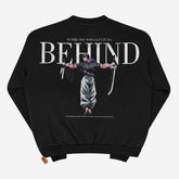 This black crewneck sweatshirt from Jujutsu Kaisen features Toji Fushiguro with arms outstretched, holding a sword and ornate knife. "TO THE ONE WHO LEFT IT ALL BEHIND" text above, additional text below, plus an orange tag on the bottom left—ideal for anime streetwear fans.
