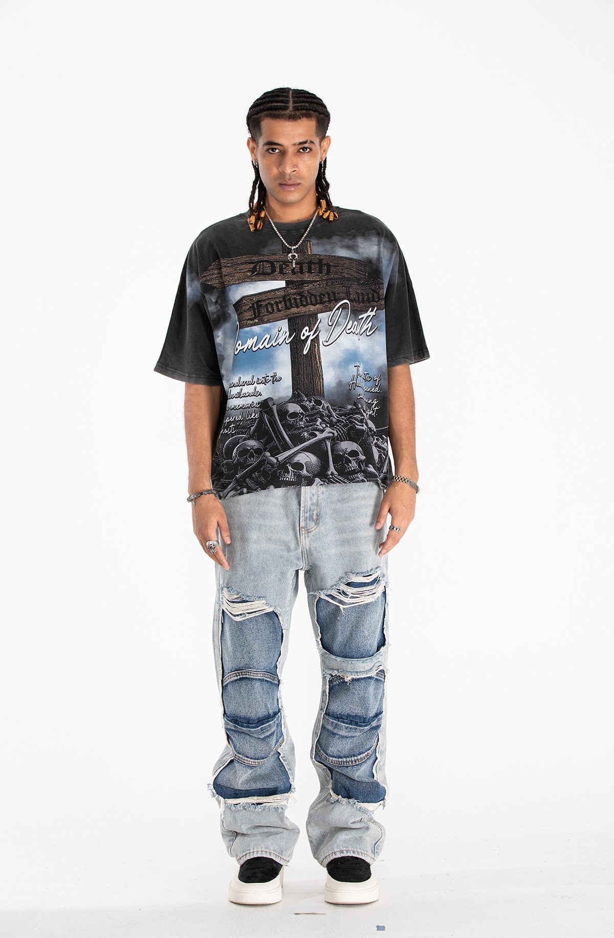 Black gothic graphic tee with Domain of Death skull print, worn with baggy distressed jeans and sneakers
