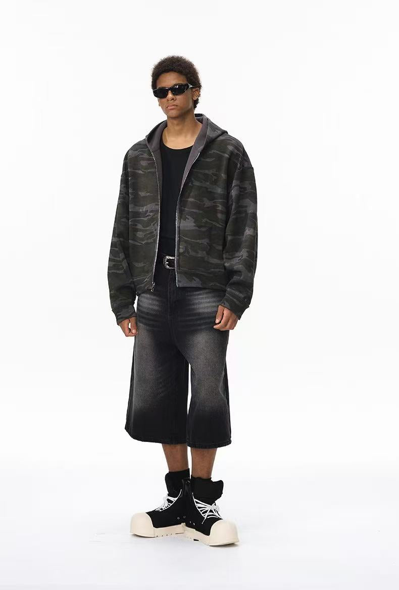 Full-length view of model wearing camo side hoodie with wide cropped pants
