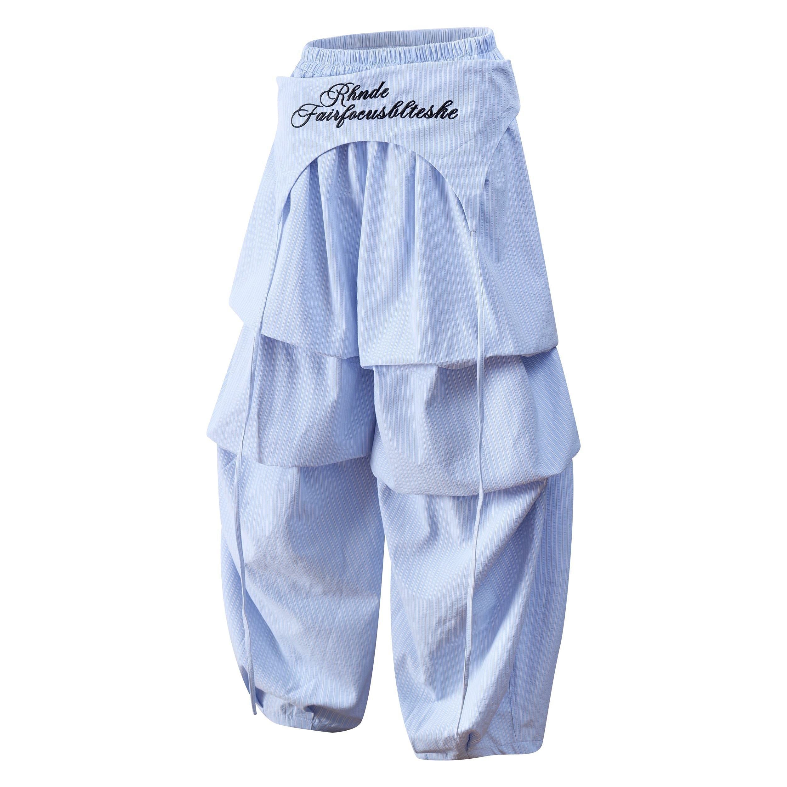 Light blue layered wide-leg pants angled front view with pleated overlay and elastic waist