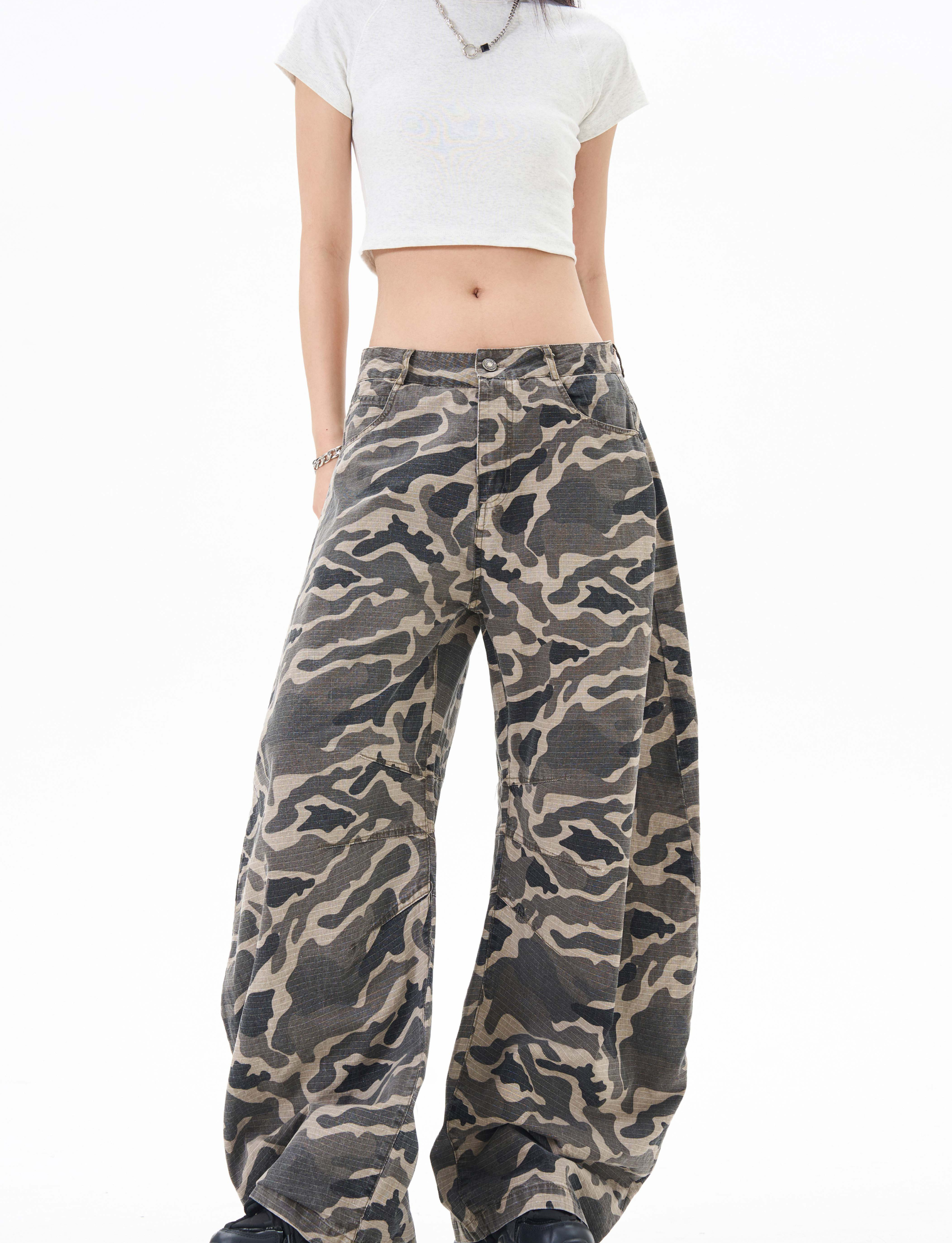 Model wearing grey camo barrel pants, front view with relaxed fit and curved silhouette