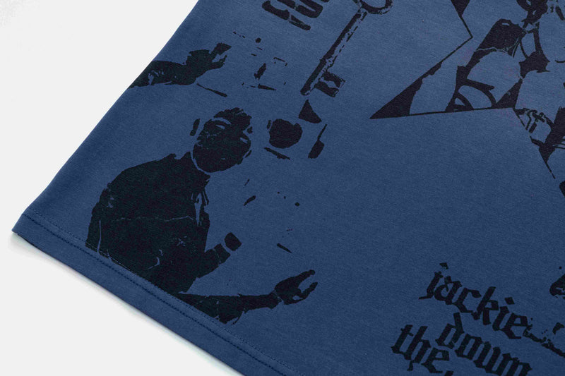 Close-up of a navy oversized graphic tee with black vintage-style star and portrait print on soft cotton fabric