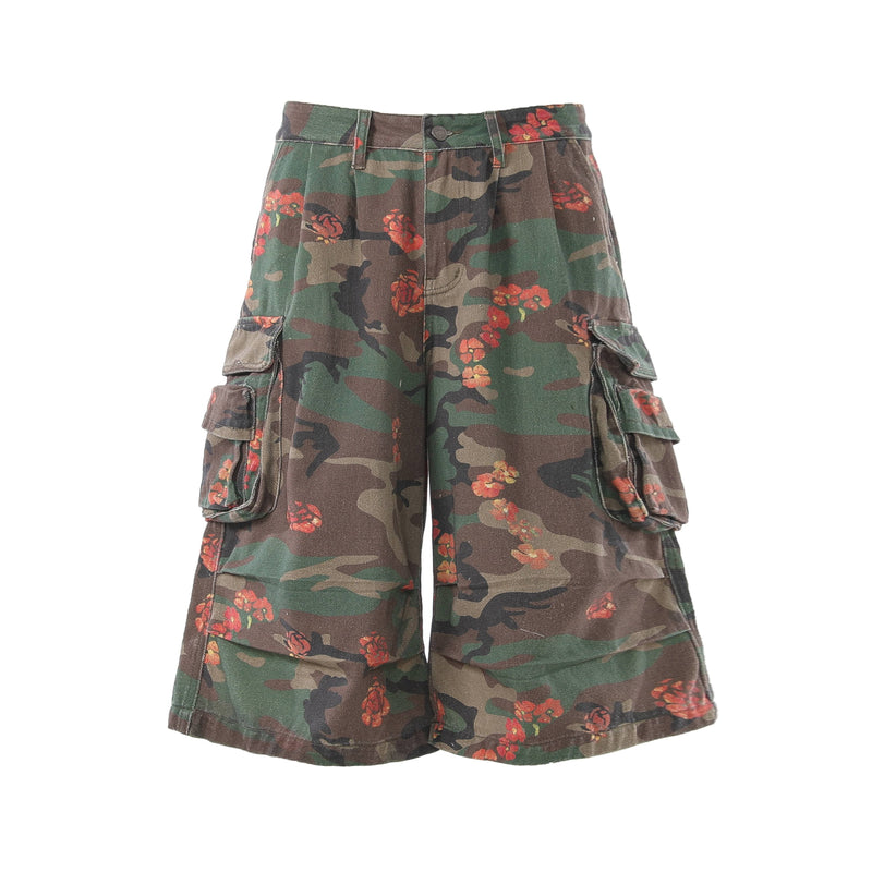 Front view of floral camo cargo shorts with wide legs and side flap pockets