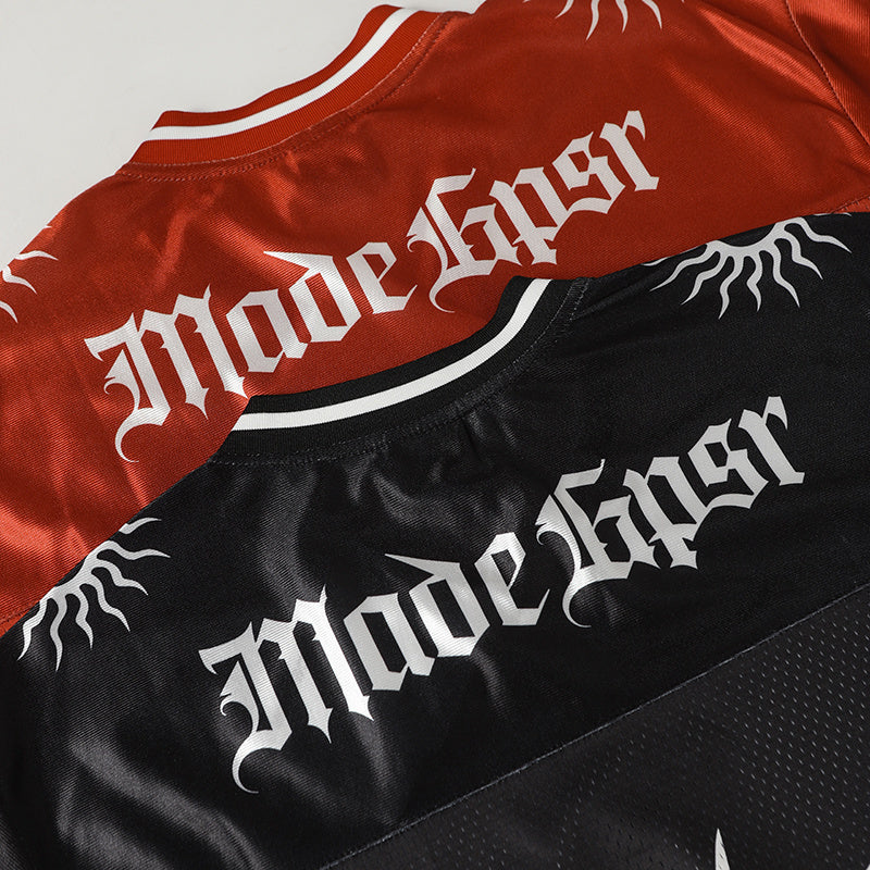 Red and black streetwear football jersey with Gothic Made in USA lettering and sunburst graphic details