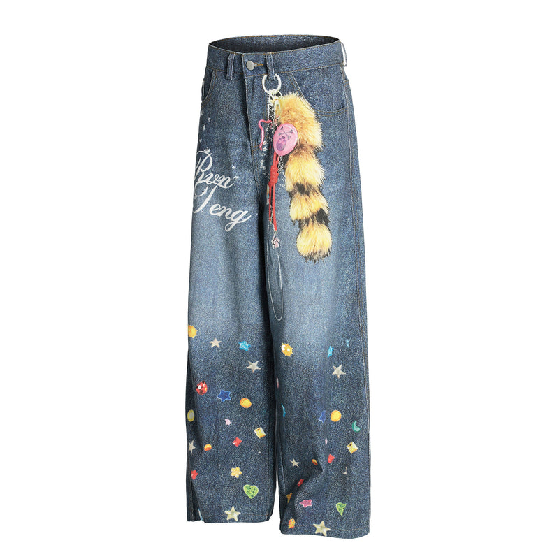 Front view of blue wide-leg jeans with gemstone and star graphics