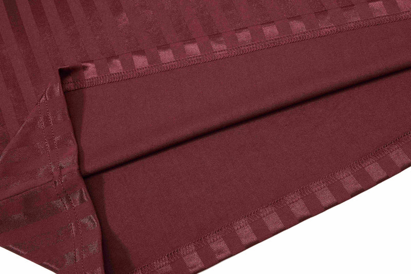 Maroon striped football jersey fabric with stitched hem and textured performance material