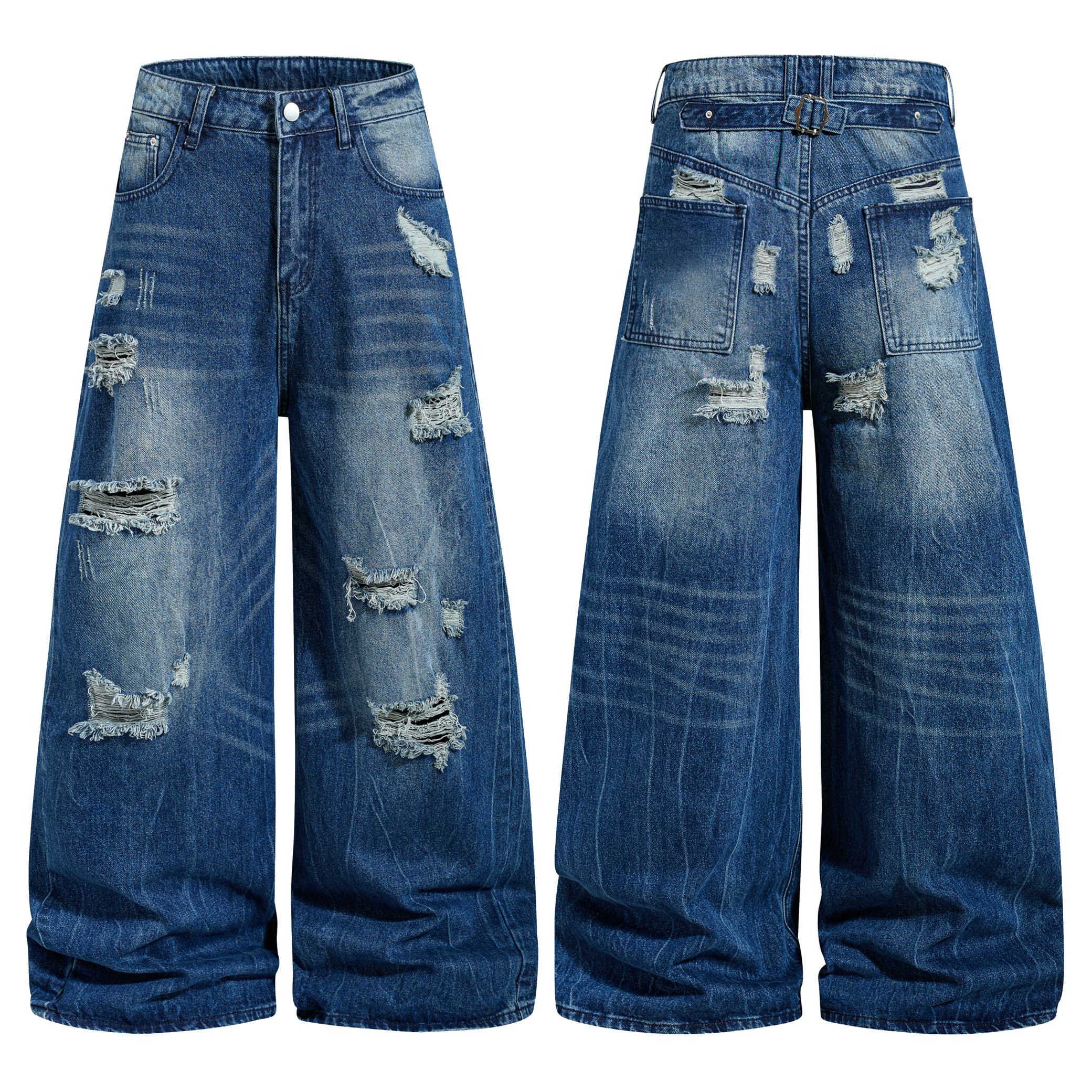 Front and back view of medium blue distressed wide-leg denim jeans with ripped detailing and vintage wash finish