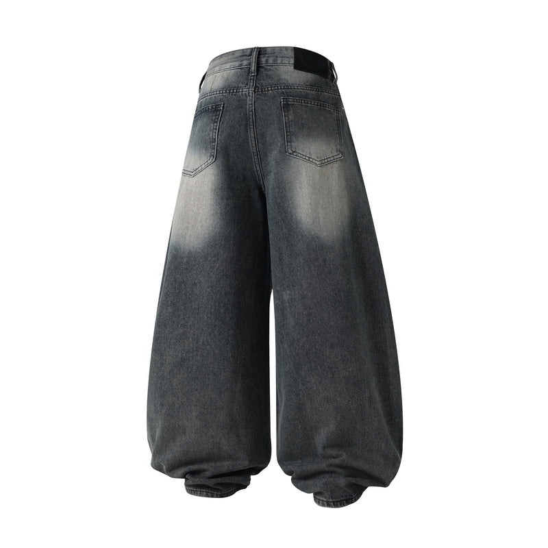 Back view of black wide-leg jeans with faded wash and plain patch pockets