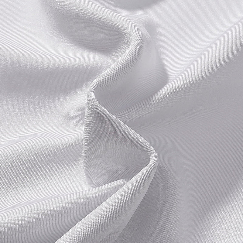 White satin-like fabric close-up with soft folded drape