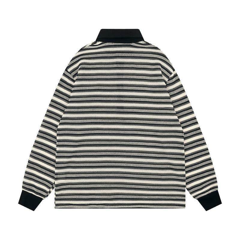 Back view of black and cream striped knit long-sleeve polo with solid black collar and cuffs