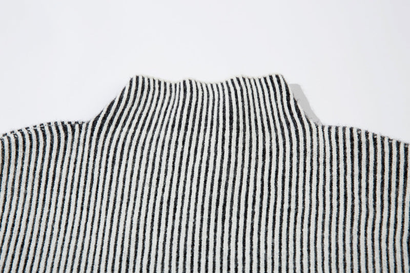 Close-up of white ribbed knit turtleneck collar with black stripes