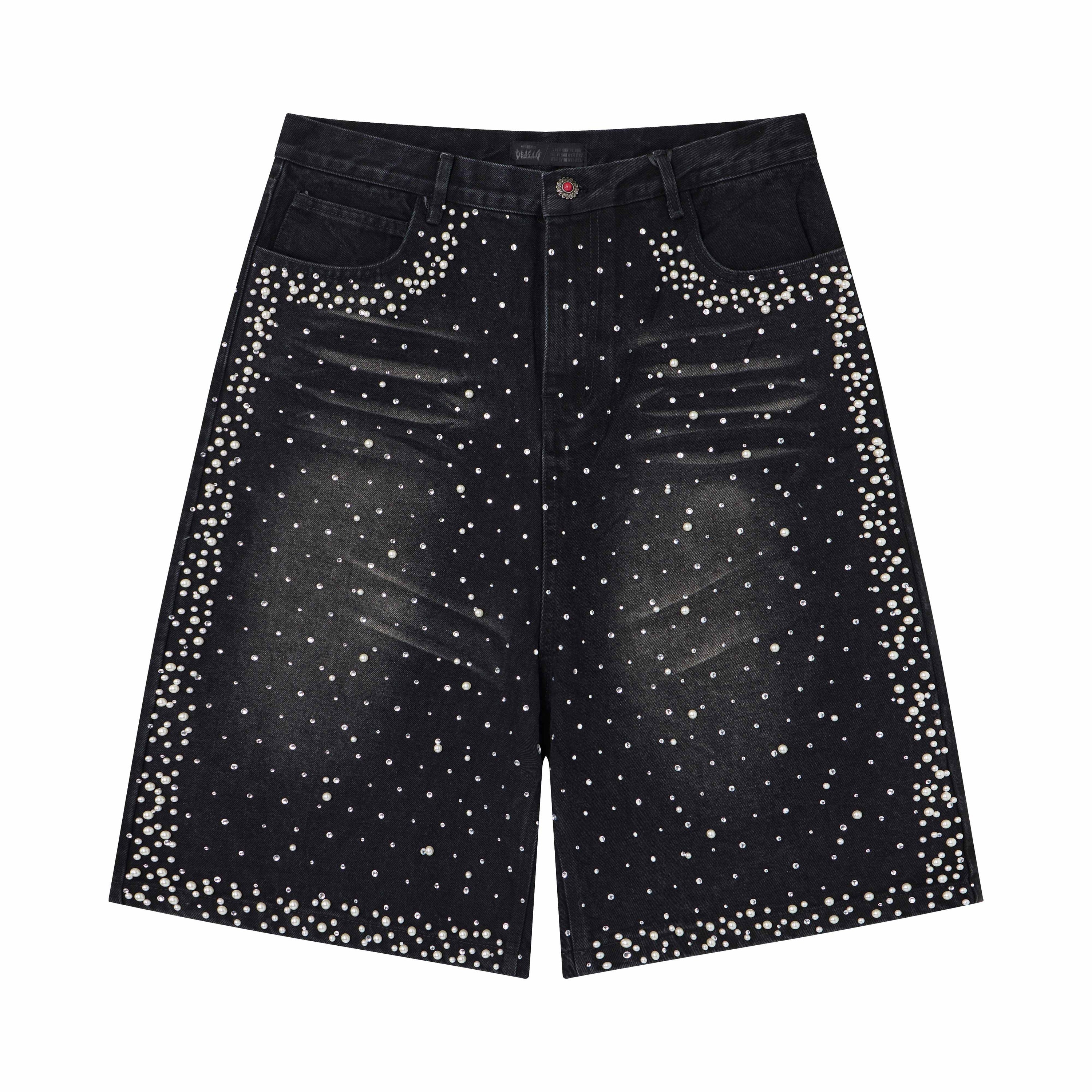 Front view of black washed denim shorts with scattered pearl and crystal stud embellishment across the fabric