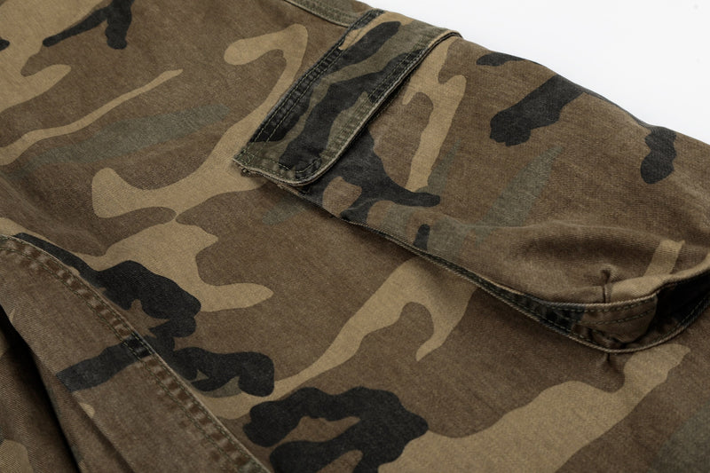 Close-up of camouflage cargo pocket on the leg of wide denim jeans