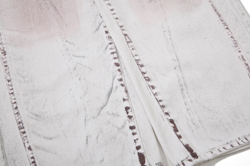 Close-up of washed denim fabric with vertical panel seams and brown stitching