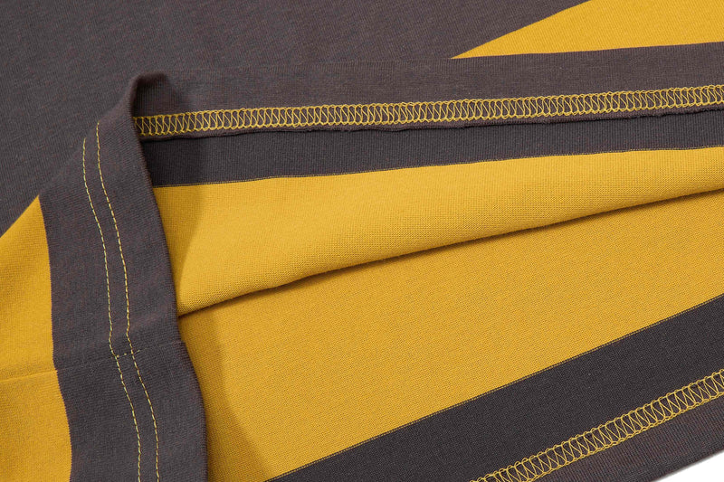 Close-up of a brown and yellow striped rugby polo shirt with contrast stitching and textured cotton fabric