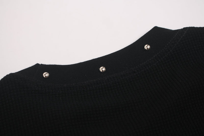 Black oversized gothic tee with ribbed texture and silver stud details along the neckline