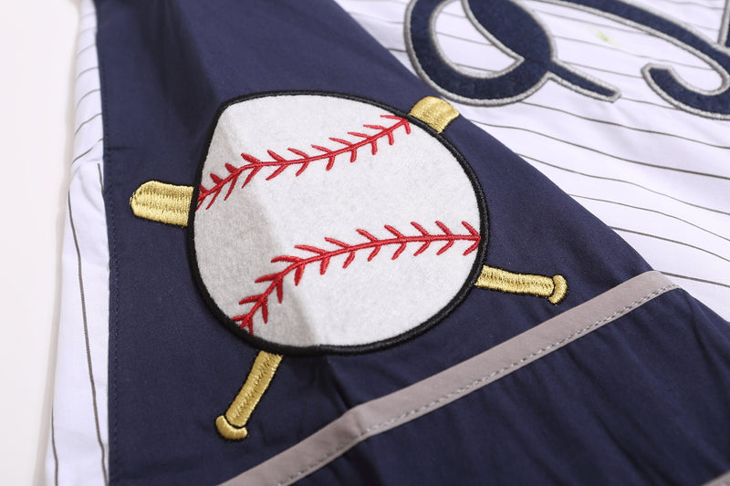 Close-up of embroidered baseball graphic on navy shoulder panel