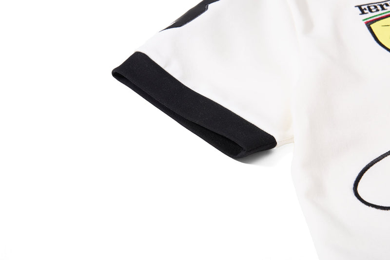 White polo shirt with black sleeve cuff and bold skatepark crest graphic on the chest