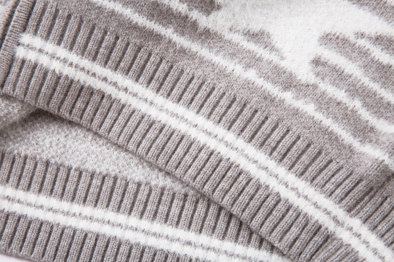 Close-up of the sleeve ribbed cuff and striped knit texture