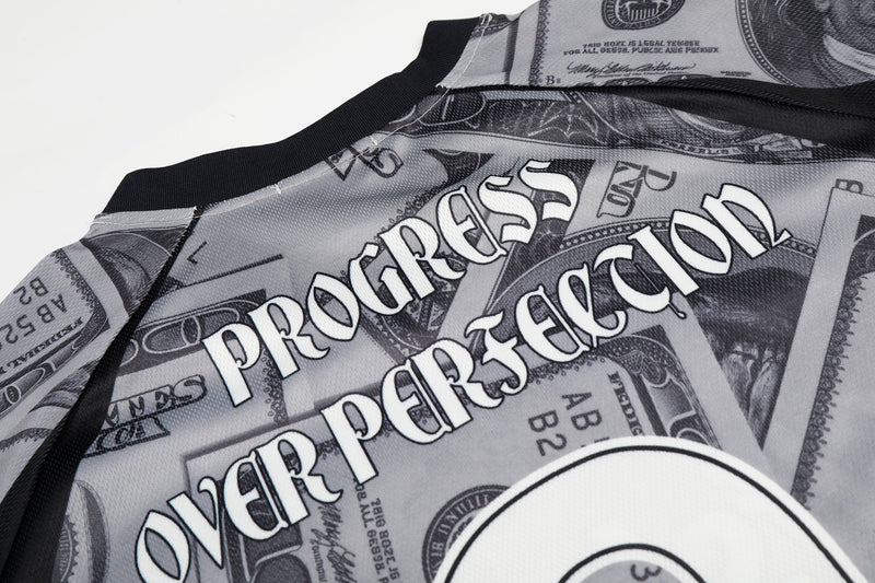 Dollar bill print mesh football jersey with black trim and bold streetwear graphic design close-up