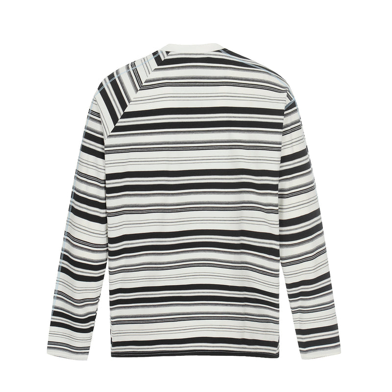 Back view of black and white striped long sleeve crewneck tee with raglan-style shoulder seams