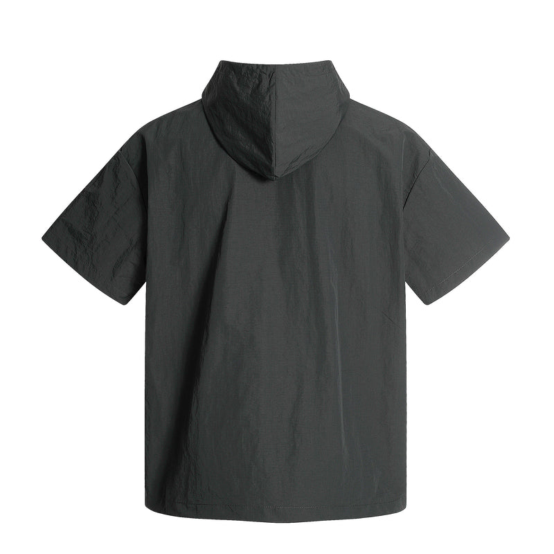 Black hooded half-zip jersey with short sleeves, relaxed streetwear fit, and lightweight nylon texture on a white background
