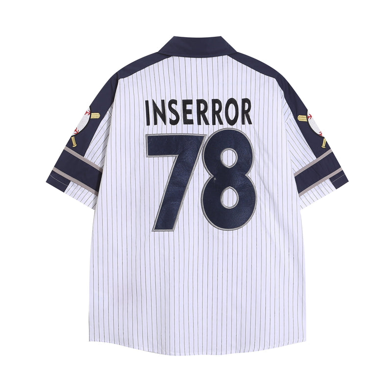 Back view of white pinstripe baseball jersey with navy shoulders and large INSERROR 78 lettering