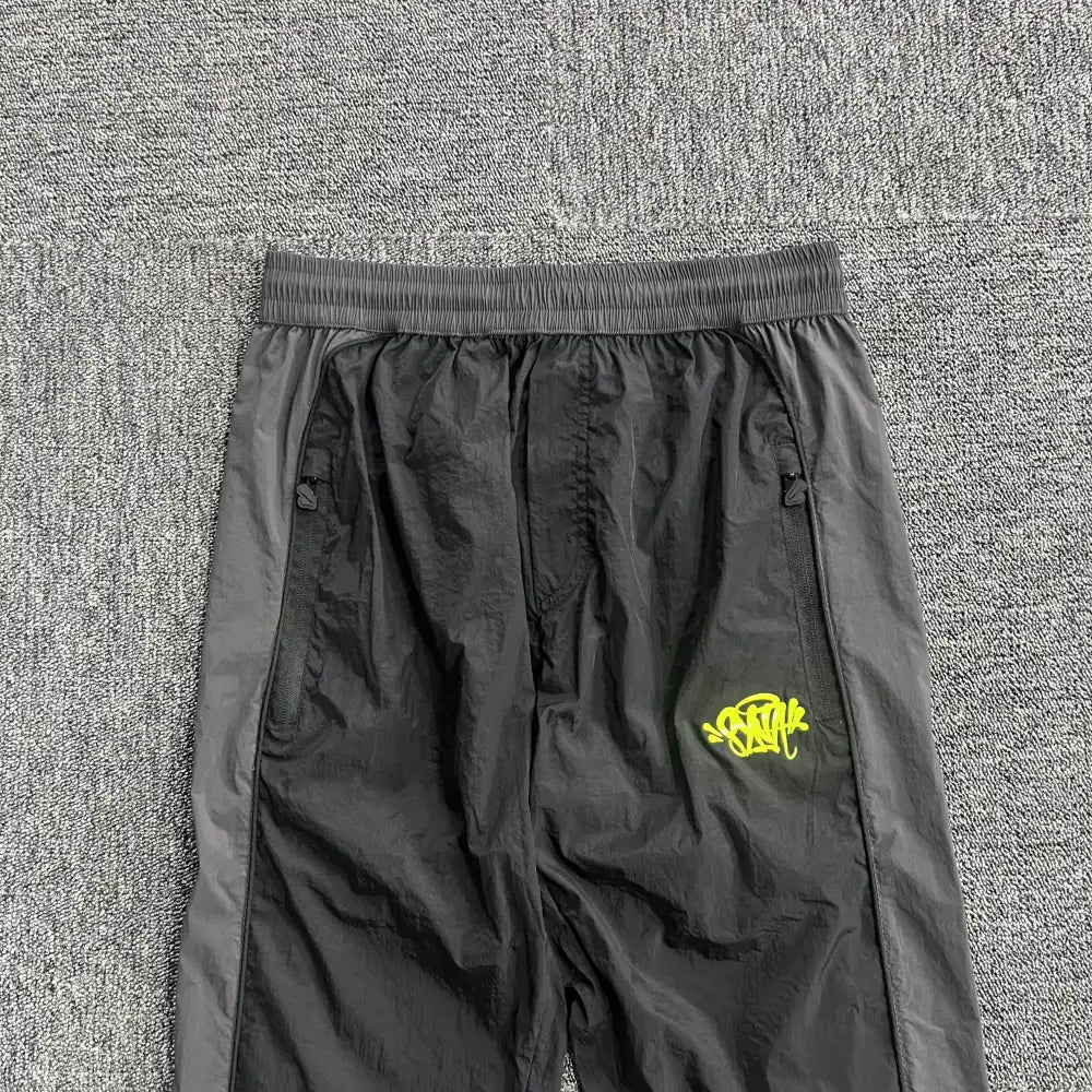 Syna World Black Yellow Logo Track Pants