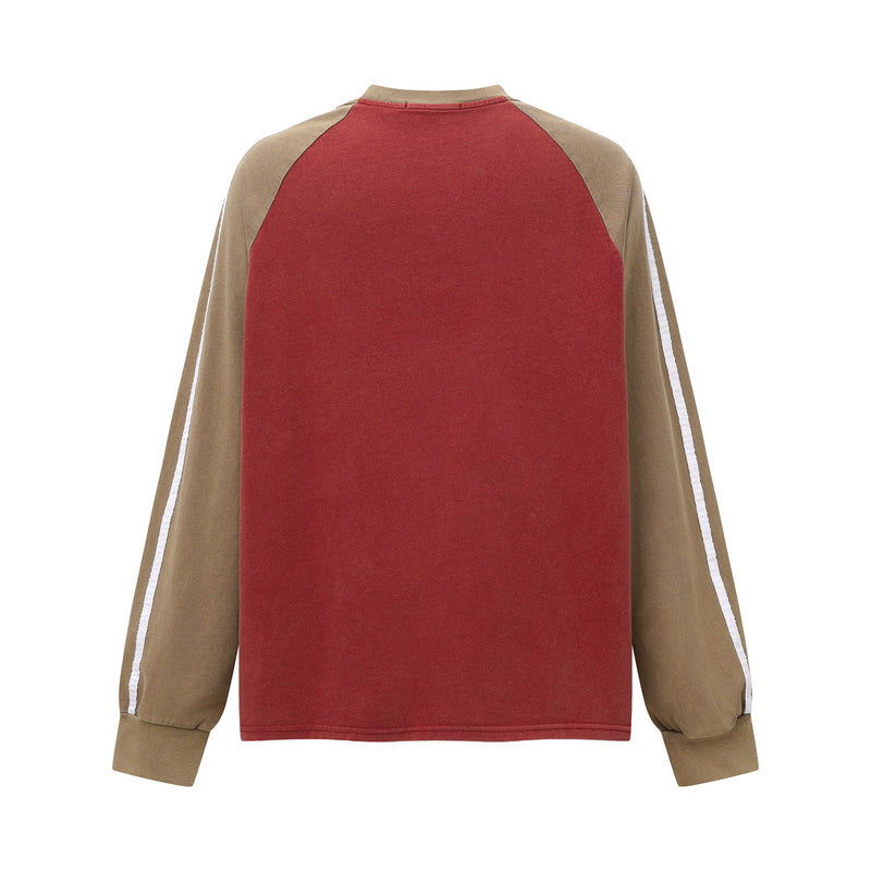 Back view of red raglan long sleeve tee with tan sleeves and white side stripes