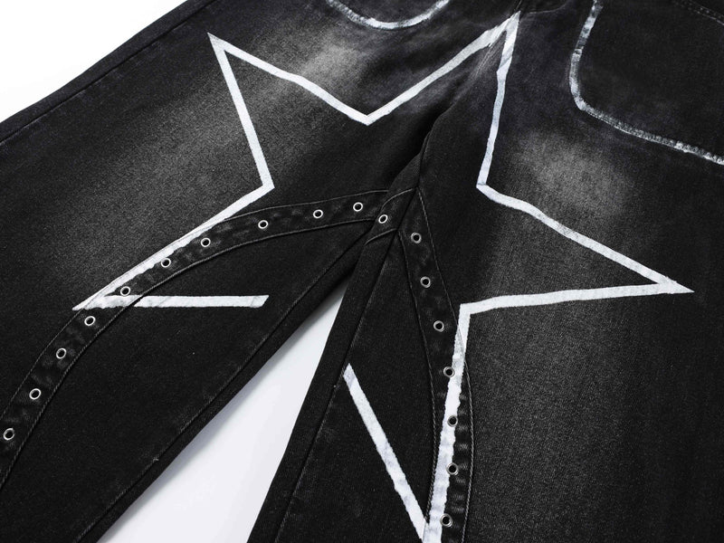 Front view of black jeans legs with white star graphics and side grommet trim